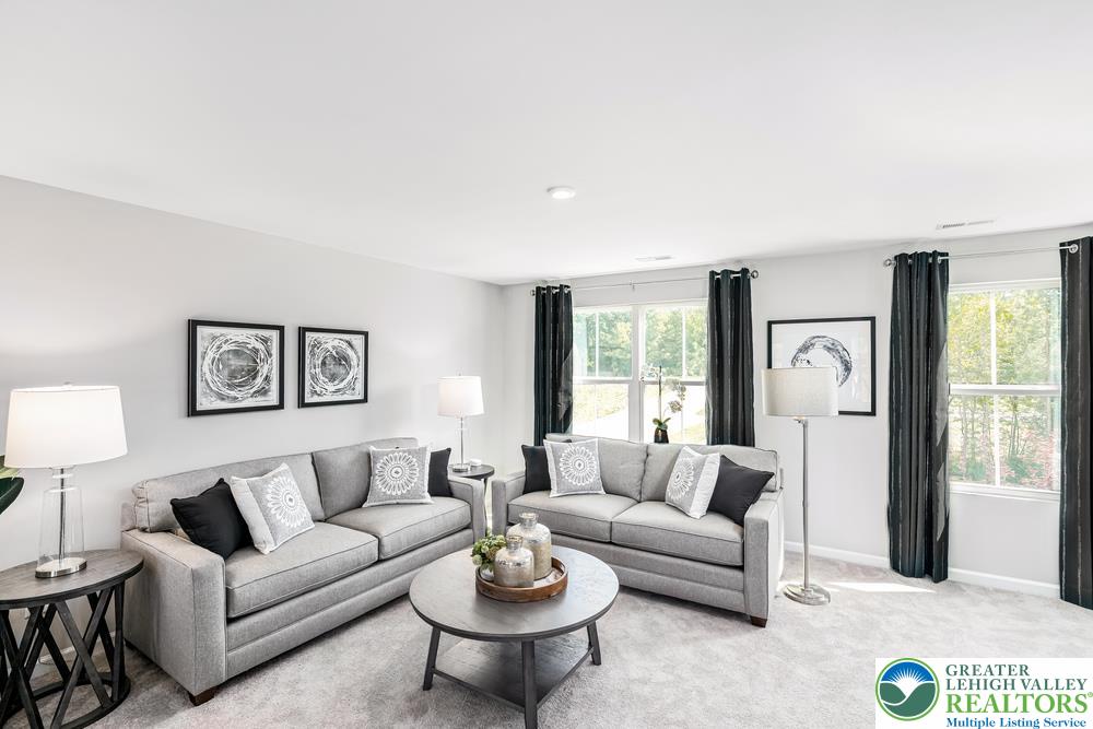 66 Shiloh Road, Unit J2 Orwigsburg, PA 17961 - Photo 13 of 14 a living room with furniture and a large window