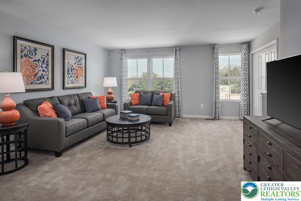 66 Shiloh Road, Unit J2 Orwigsburg, PA 17961 - Photo 7 of 14 a living room with furniture and a flat screen tv