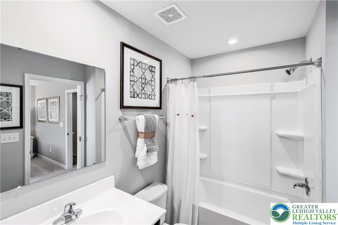 66 Shiloh Road, Unit J2 Orwigsburg, PA 17961 - Photo 10 of 14 a bathroom with a shower and toilet