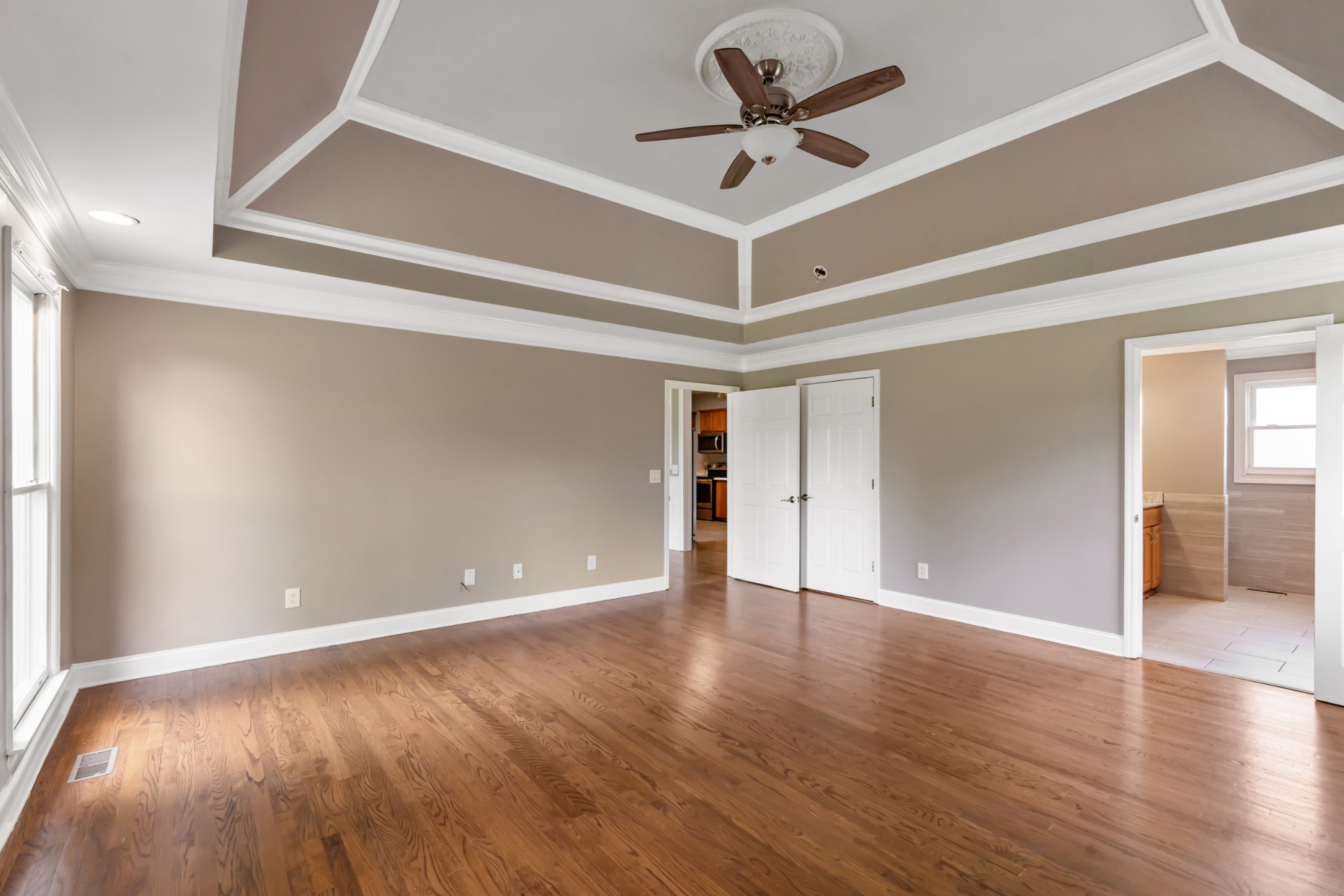 4602 Washington Road Springfield, TN 37172 - Photo 20 of 63 a view of an empty room with wooden floor and a ceiling fan