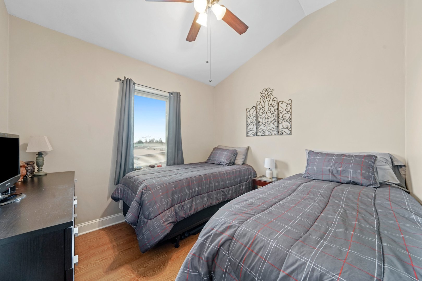 3922 Wehrman Avenue, Unit 3922 Schiller Park, IL 60176 - Photo 17 of 28 a bedroom with two beds and a chandelier