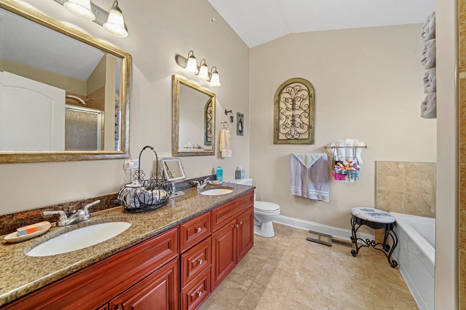 3922 Wehrman Avenue, Unit 3922 Schiller Park, IL 60176 - Photo 21 of 28 a bathroom with double vanity sinks a mirror and a lamp