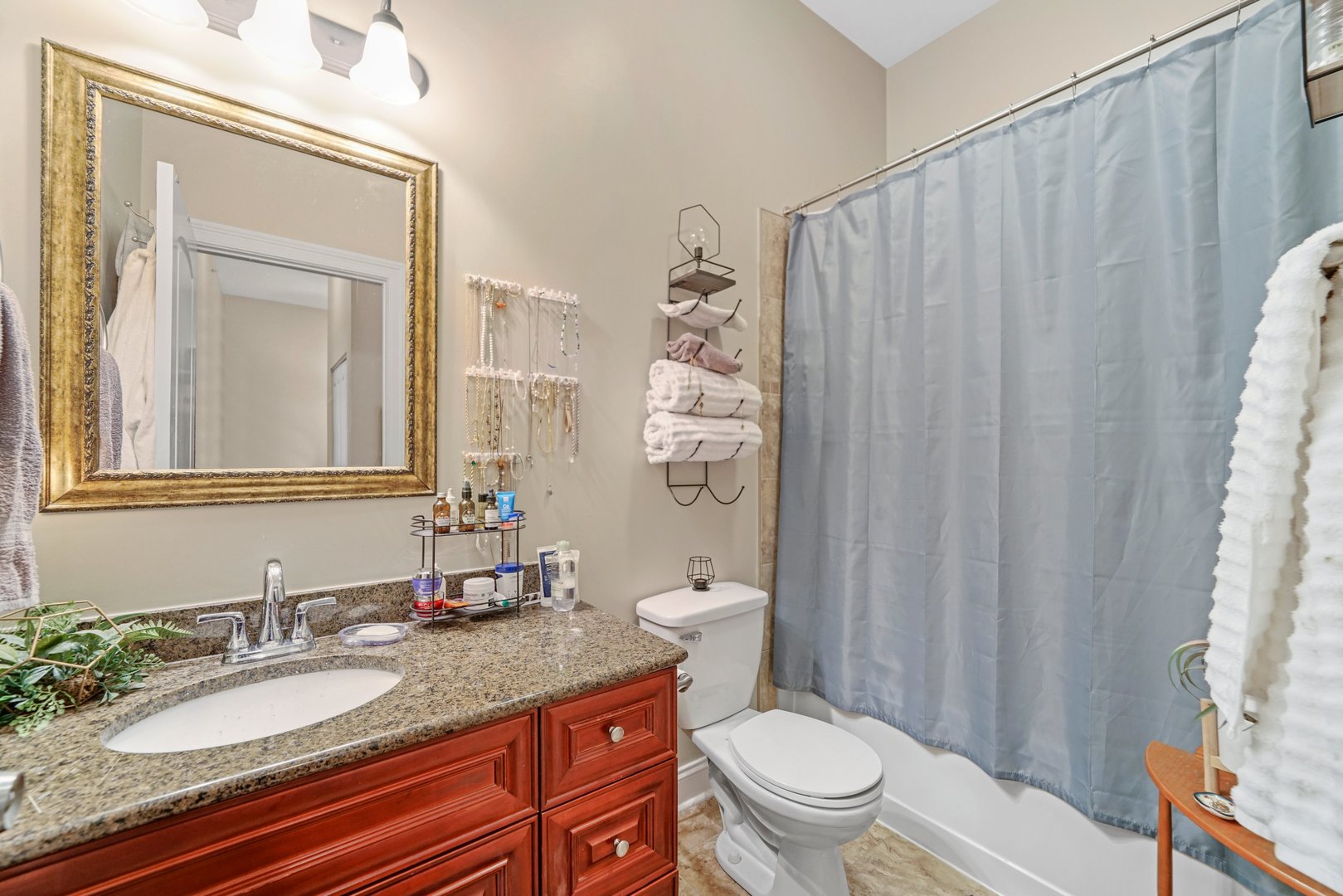 3922 Wehrman Avenue, Unit 3922 Schiller Park, IL 60176 - Photo 22 of 28 a bathroom with a granite countertop sink toilet and a mirror