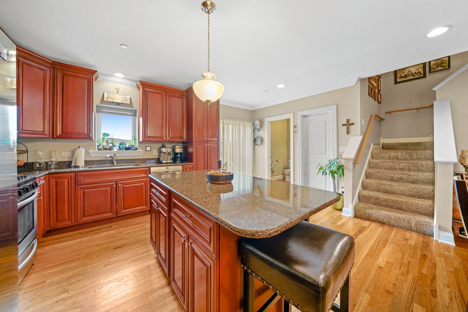 3922 Wehrman Avenue, Unit 3922 Schiller Park, IL 60176 - Photo 7 of 28 a kitchen with granite countertop a sink a counter space appliances and cabinets