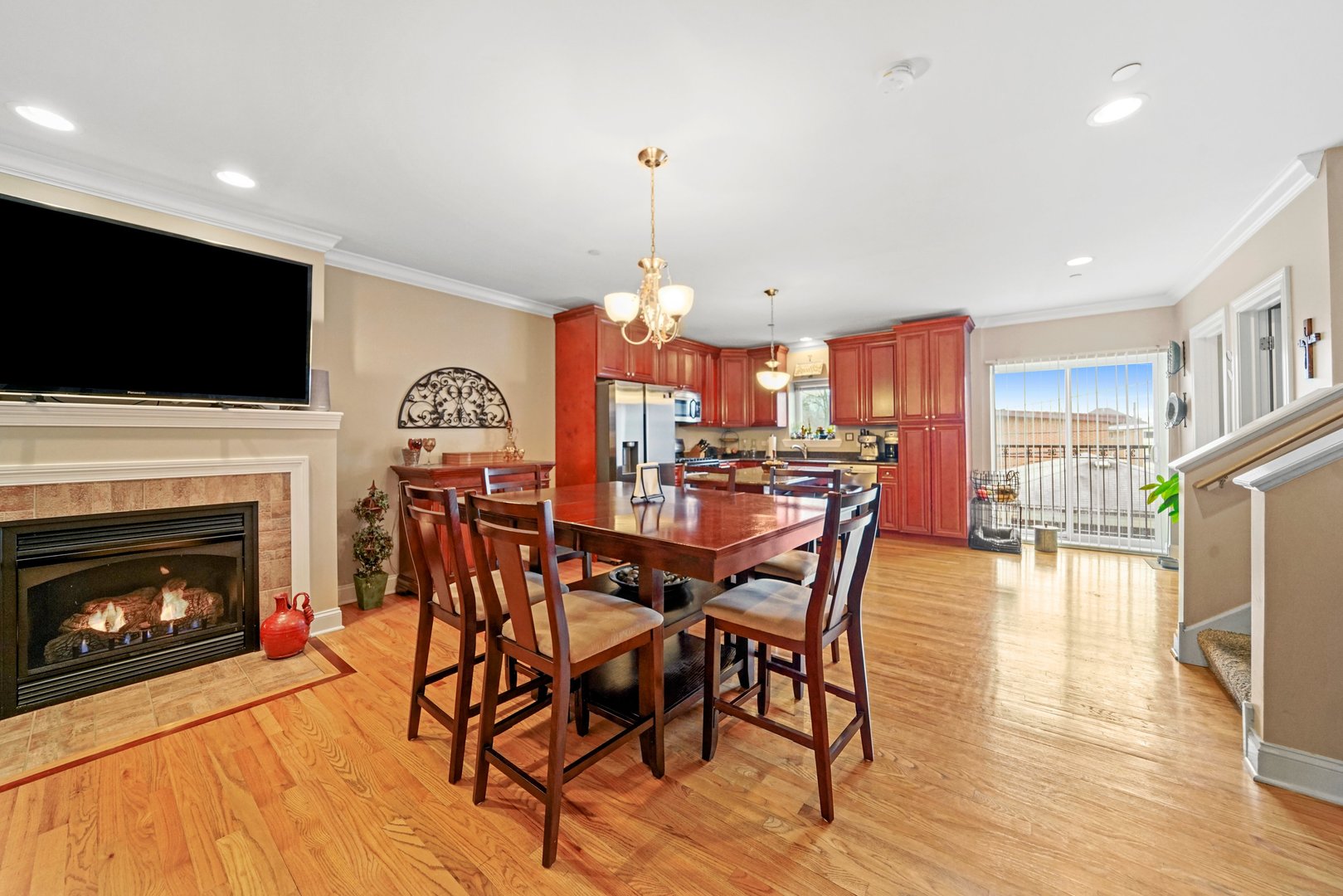 3922 Wehrman Avenue, Unit 3922 Schiller Park, IL 60176 - Photo 8 of 28 a view of a dining room with furniture wooden floor fireplace and a window