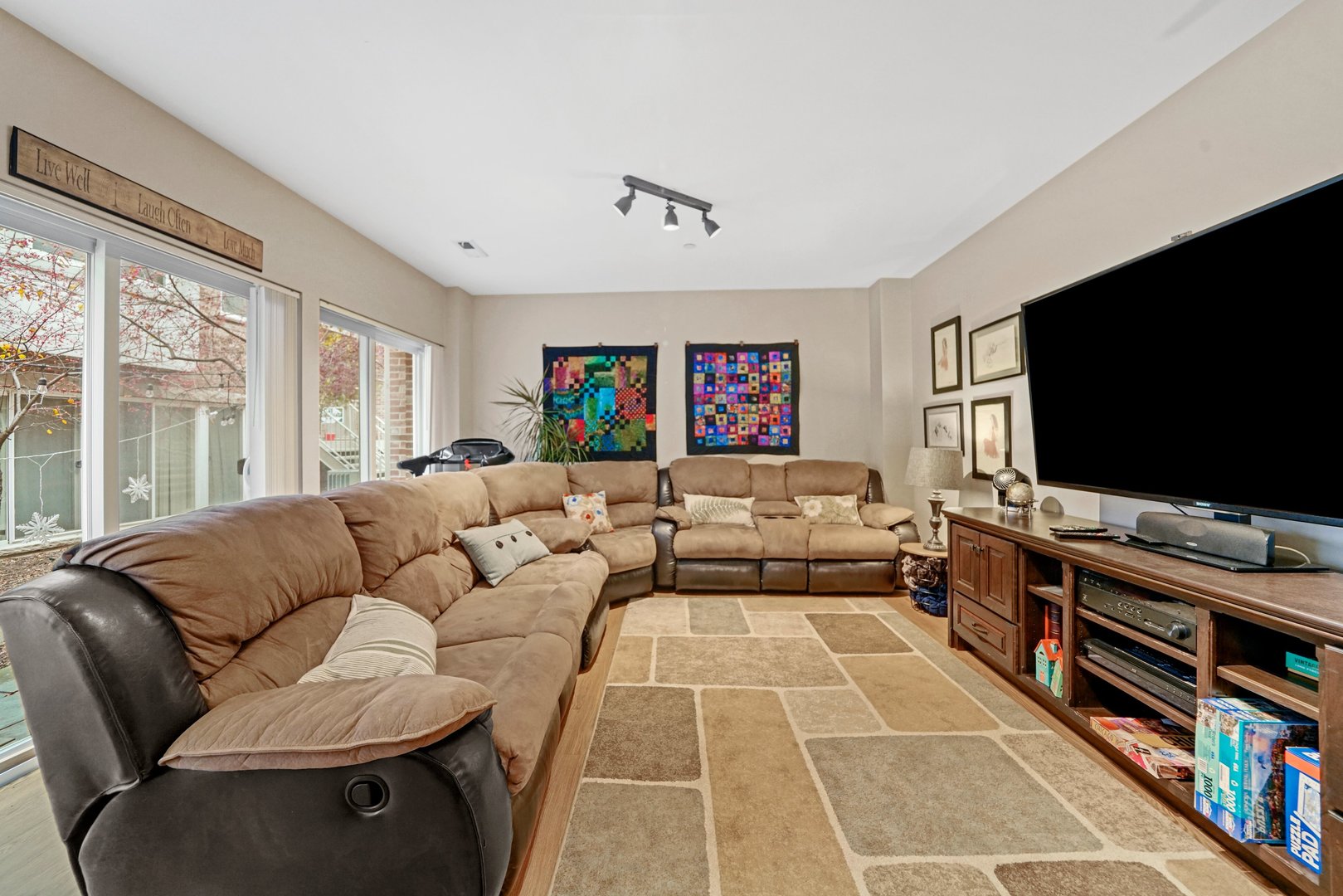 3922 Wehrman Avenue, Unit 3922 Schiller Park, IL 60176 - Photo 10 of 28 a living room with furniture and a flat screen tv