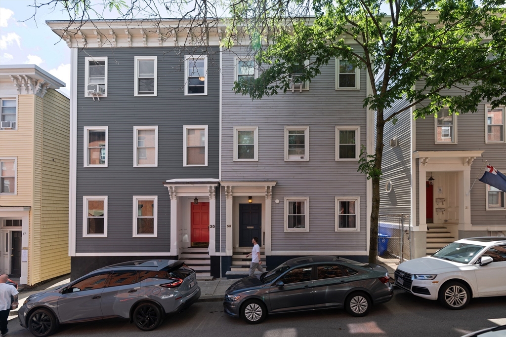 33 Mystic Street, Unit 3 Boston, MA 02129 - Photo 18 of 21 a car parked in front of a brick house