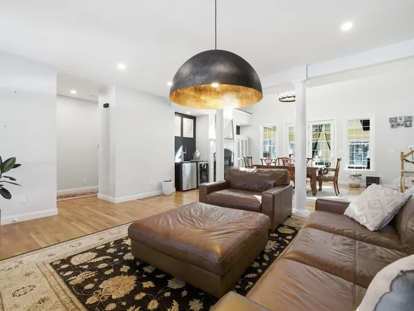 a living room with furniture and a lamp