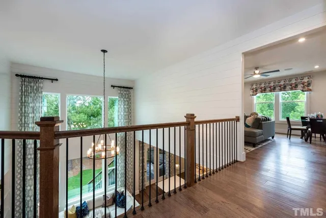 a view of a balcony with furniture and floor to ceiling window