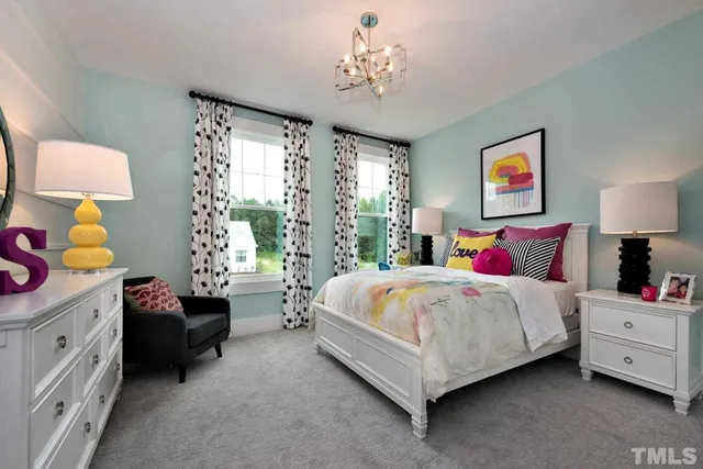 a spacious bedroom with a bed and a window