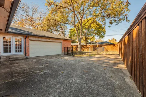 a view of garage yard and tree