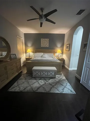 a large kitchen with a sink and large stainless steel appliances