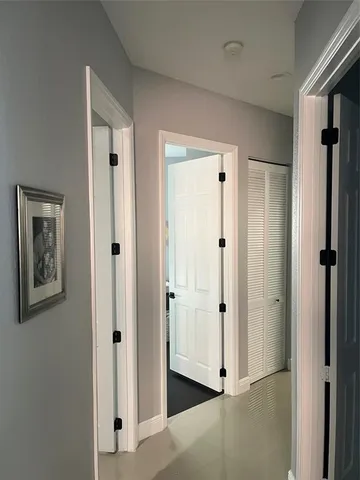 a bedroom with bed and a chandelier