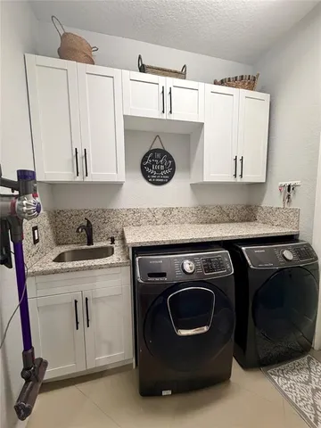 a view of a lake with couches in wooden deck