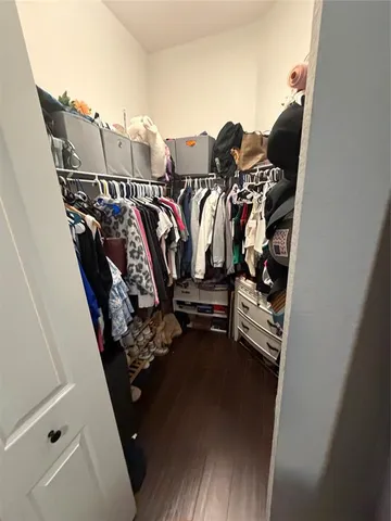 a view of a lake with a yard and large buildings