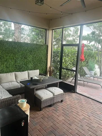 a living room with furniture a lamp and a fireplace