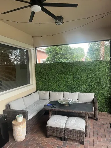 a view of a balcony with furniture and lamp