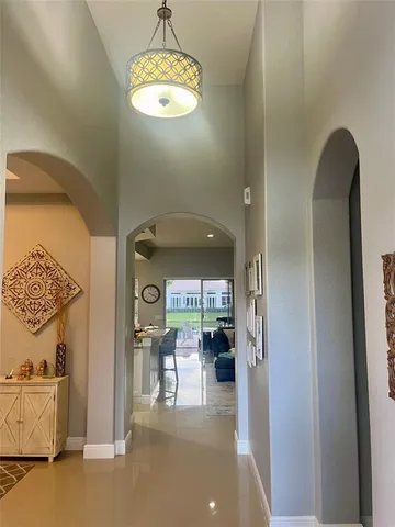 a view of a livingroom with furniture a chandelier