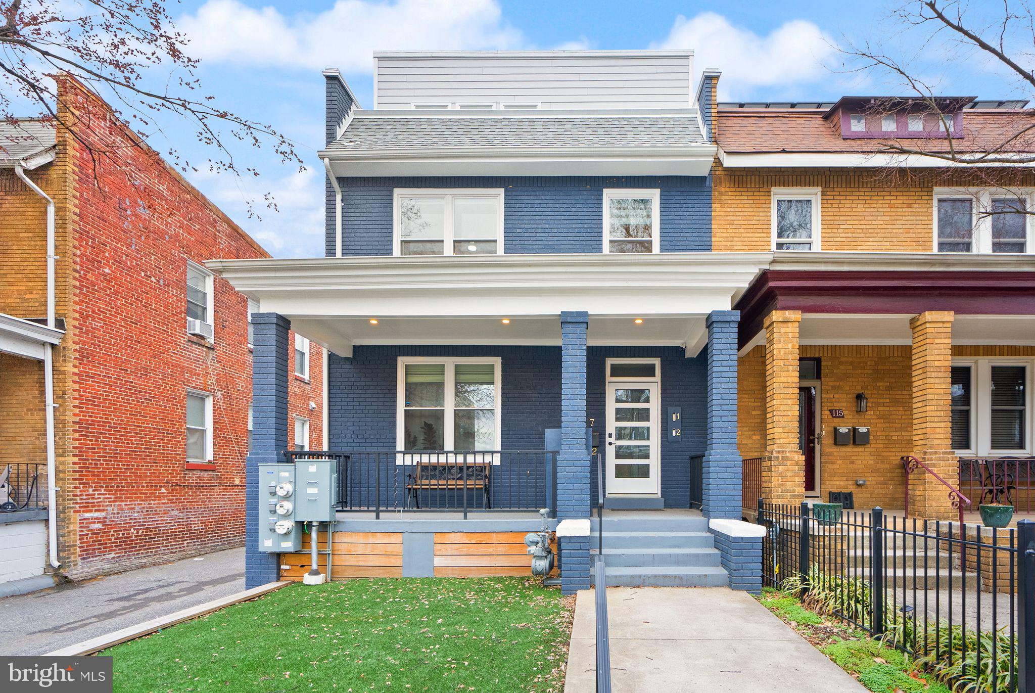 117 17th Street Southeast, Unit 2 Washington, DC 20003 - Photo 1 of 31 front view of a house with a yard