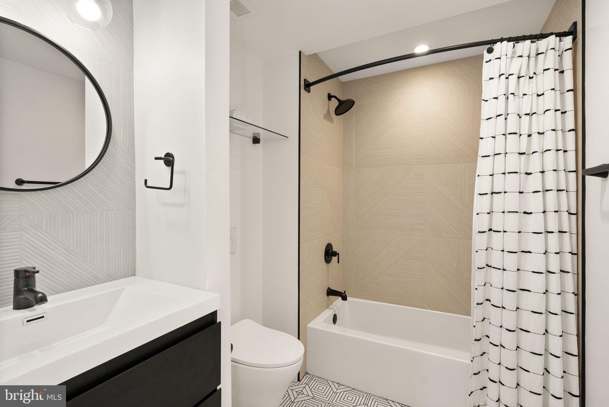 117 17th Street Southeast, Unit 2 Washington, DC 20003 - Photo 18 of 31 a bathroom with a sink toilet and shower