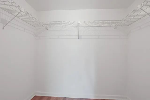 a bathroom with a sink toilet a mirror and shower