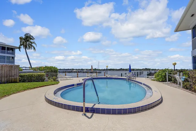 a view of a swimming pool with a yard