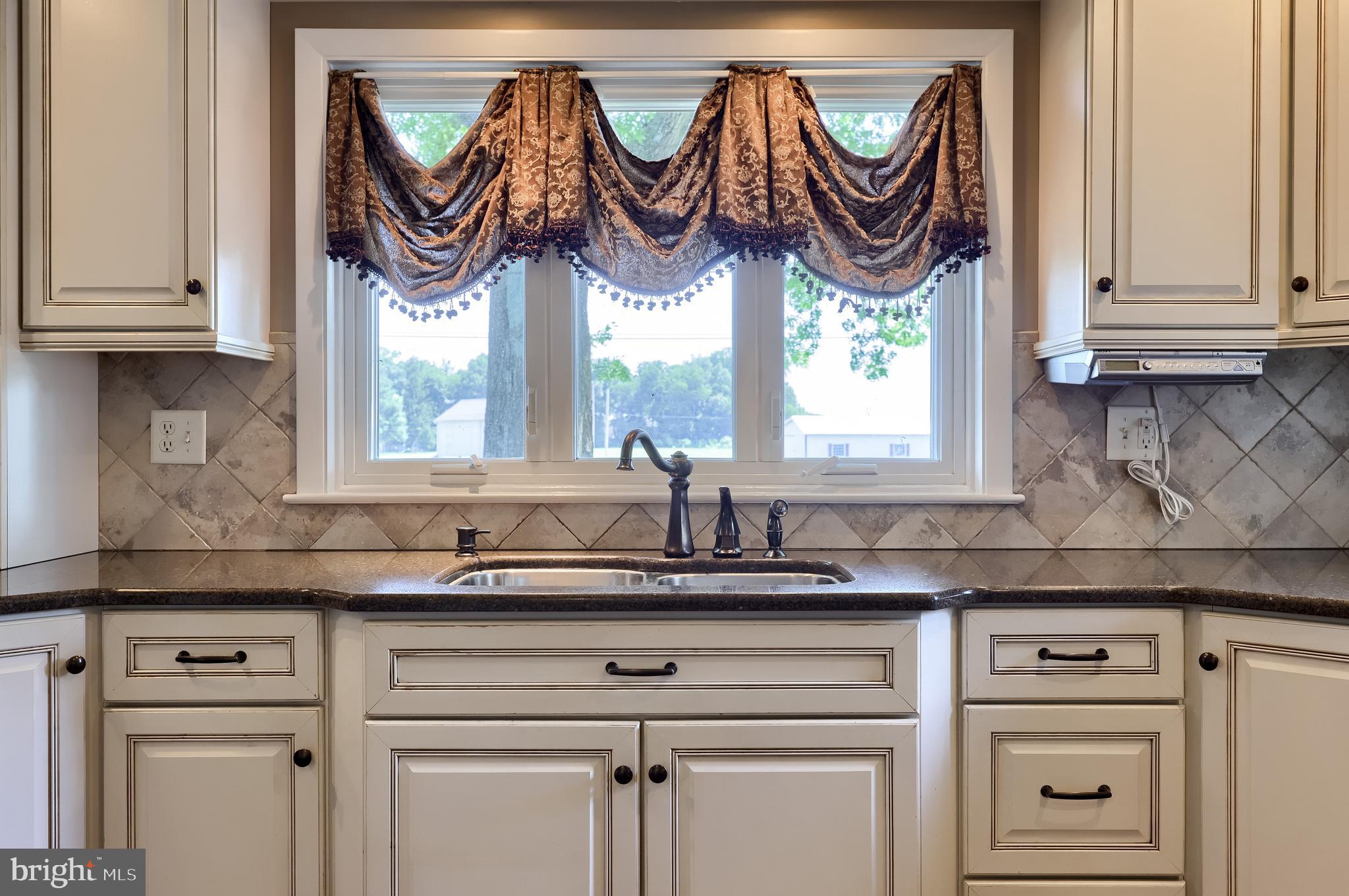 502 West Newport Road Lititz, PA 17543 - Photo 32 of 61 a kitchen with stainless steel appliances granite countertop white cabinets and a window