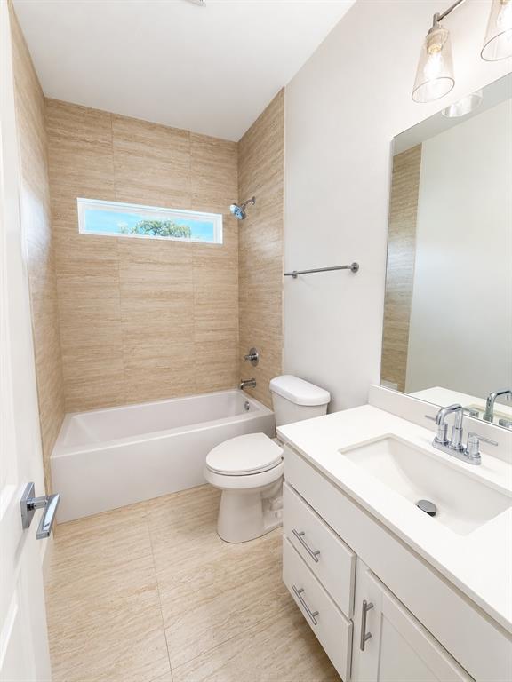 3529 Cleveland Street Dallas, TX 75215 - Photo 4 of 5 a bathroom with a sink a toilet and bathtub