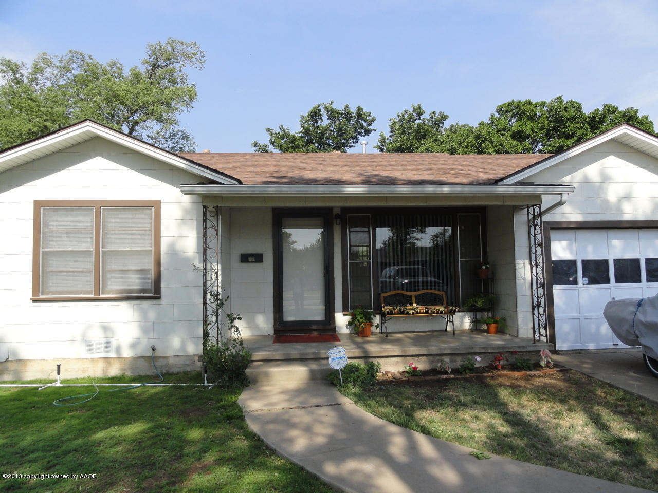 4002 South Jackson Street Amarillo, TX 79110 - Photo 1 of 9 a view of a house with swimming pool and furniture