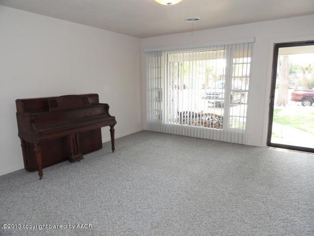 4002 South Jackson Street Amarillo, TX 79110 - Photo 2 of 9 a living room with furniture and a window
