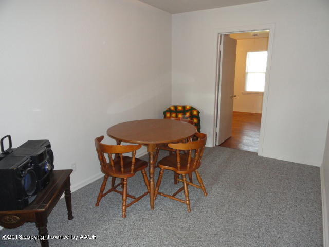 4002 South Jackson Street Amarillo, TX 79110 - Photo 3 of 9 a dining room with furniture and window