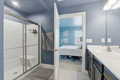 a bathroom with a tub sink and a mirror