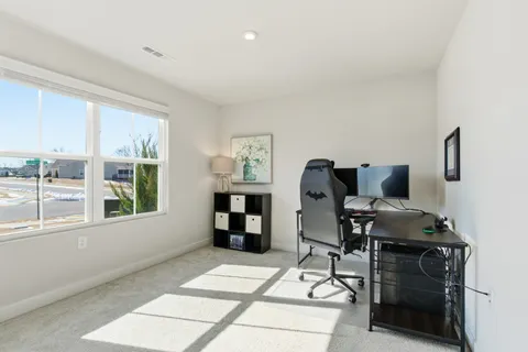 a workspace with furniture and a window