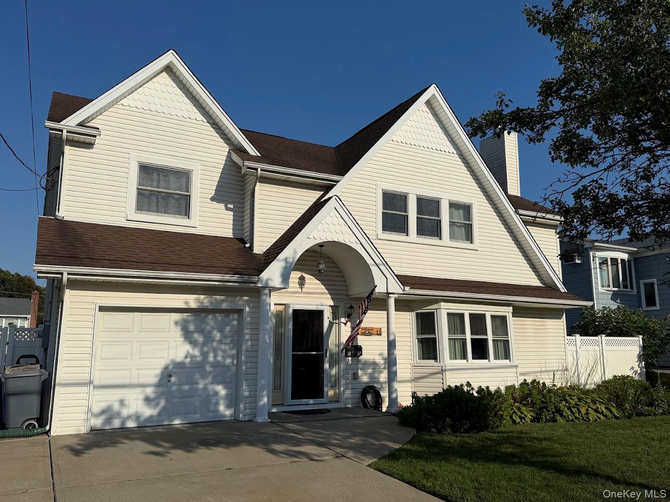 55 Lester Avenue Freeport, NY 11520 - Photo 1 of 38 a front view of a house with a yard