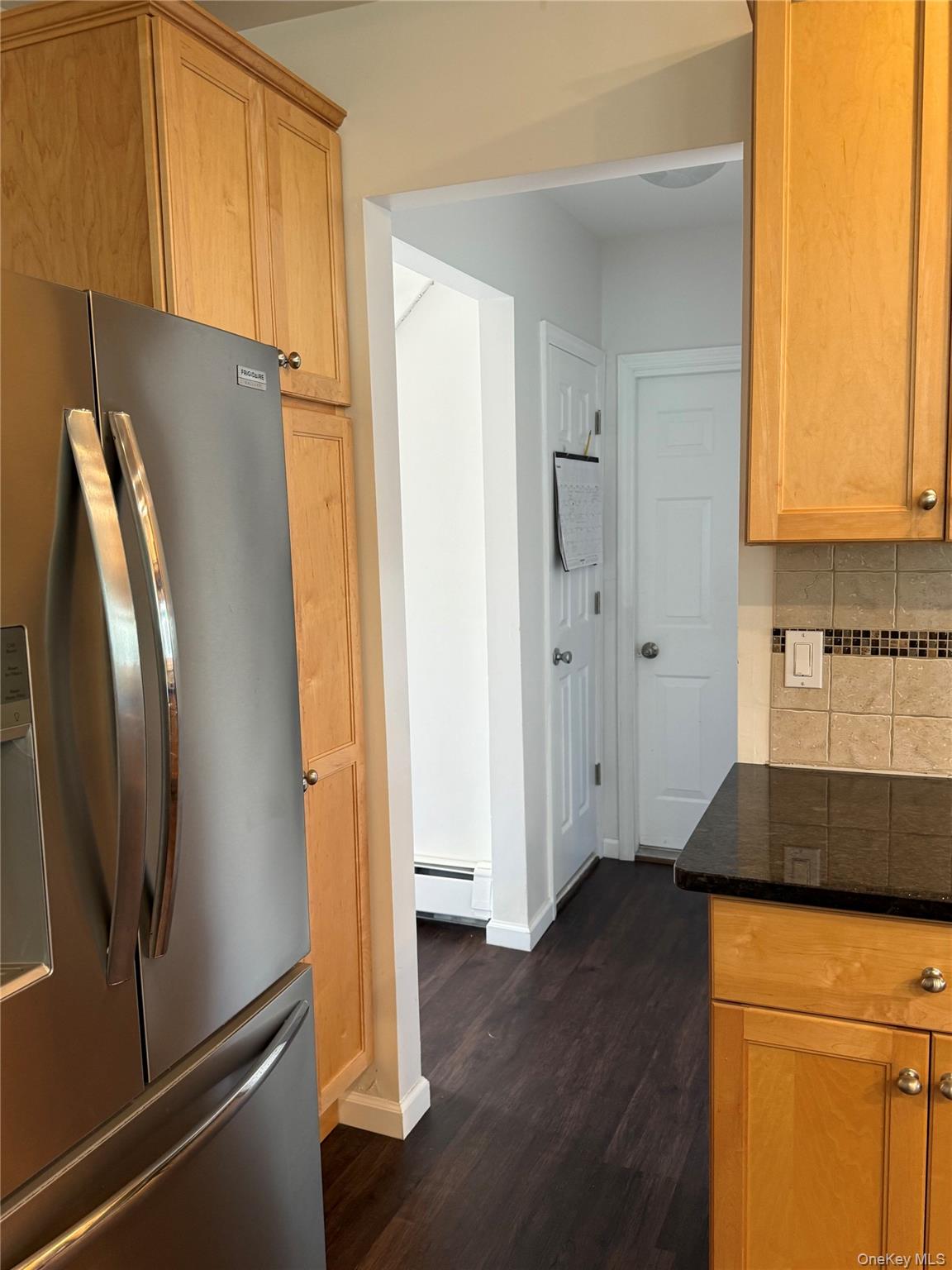 55 Lester Avenue Freeport, NY 11520 - Photo 12 of 38 a kitchen with a refrigerator and a stove