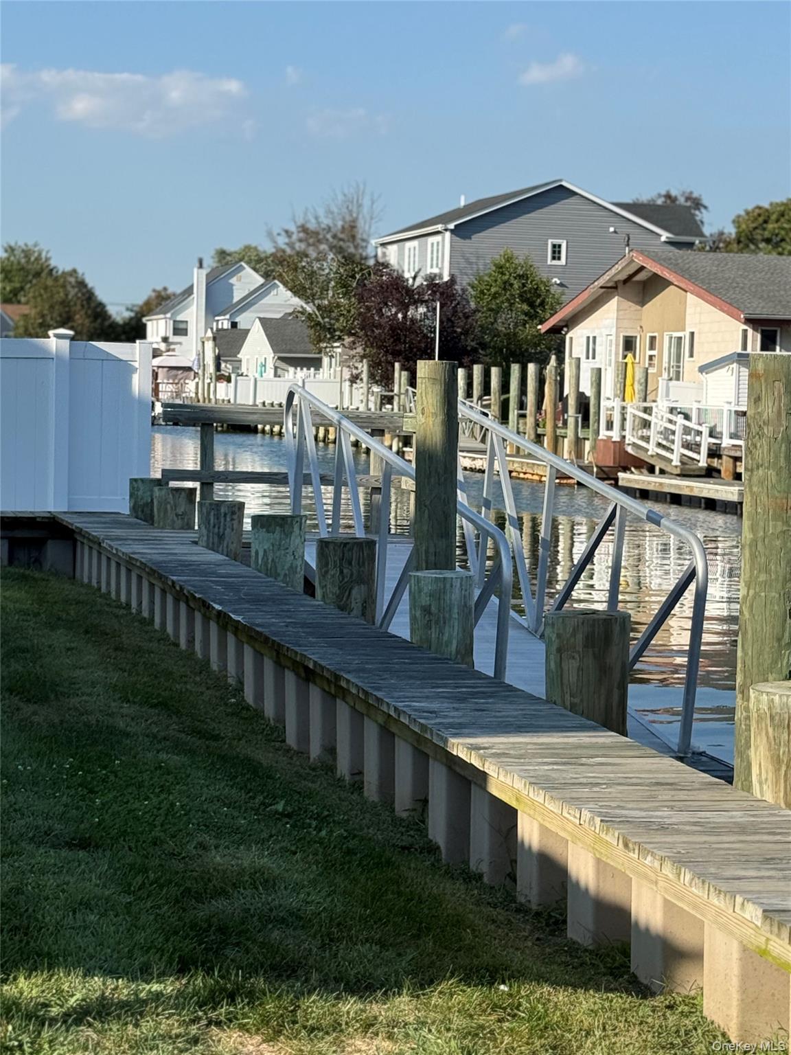 55 Lester Avenue Freeport, NY 11520 - Photo 20 of 38 a view of a house with a yard from a balcony