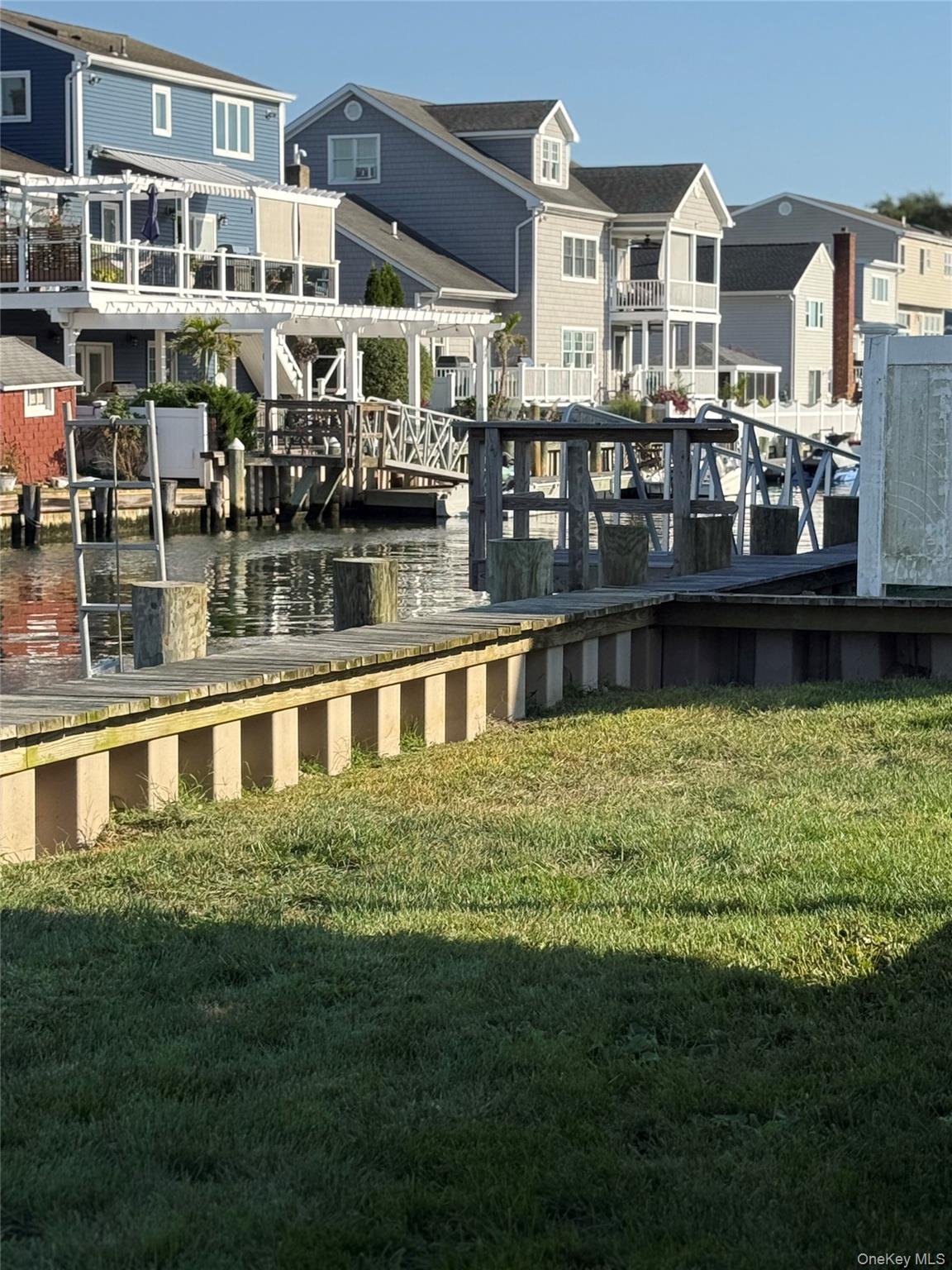 55 Lester Avenue Freeport, NY 11520 - Photo 21 of 38 a large pool is sitting in the middle of a lake