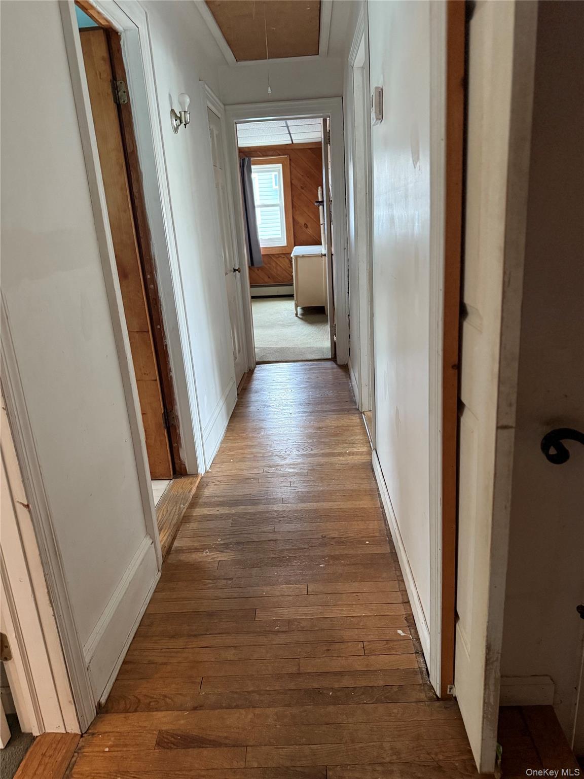 55 Lester Avenue Freeport, NY 11520 - Photo 25 of 38 a view of a hallway with wooden floor and staircase