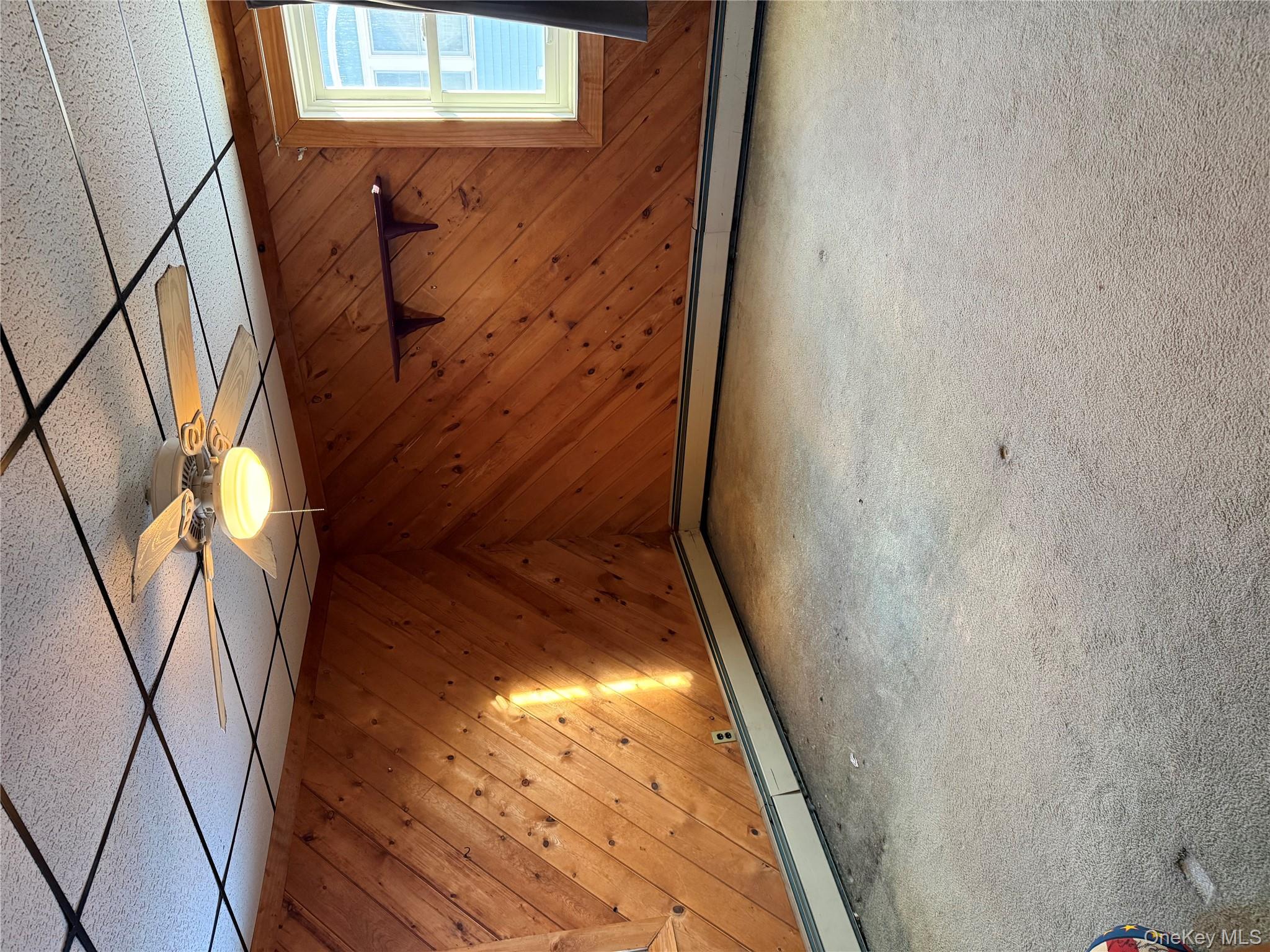 55 Lester Avenue Freeport, NY 11520 - Photo 26 of 38 a view of a room with a wooden floor and a window