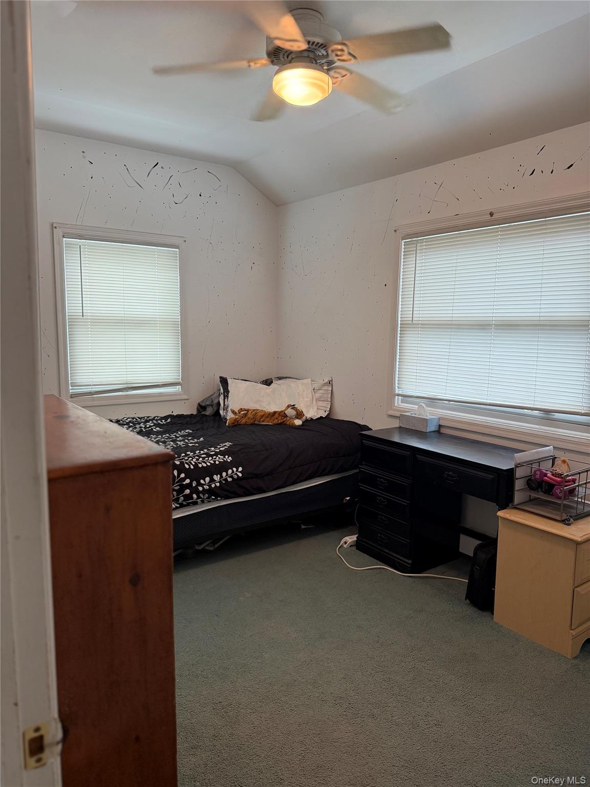55 Lester Avenue Freeport, NY 11520 - Photo 27 of 38 a bed room with a bed and a window