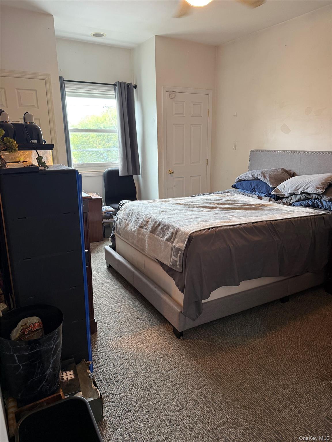 55 Lester Avenue Freeport, NY 11520 - Photo 29 of 38 a bedroom with a bed and a window