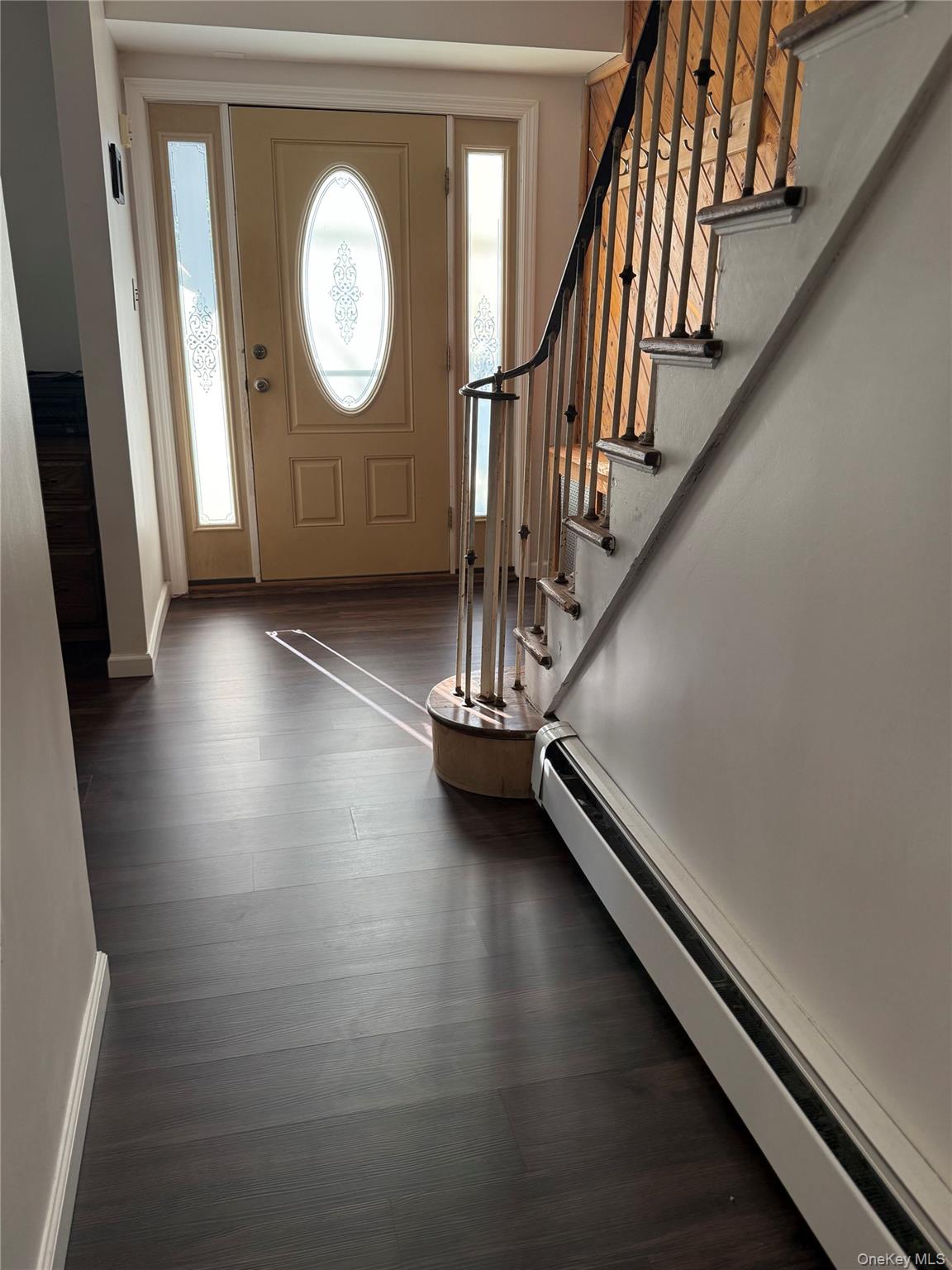 55 Lester Avenue Freeport, NY 11520 - Photo 3 of 38 a view of a livingroom with wooden floor and a staircase