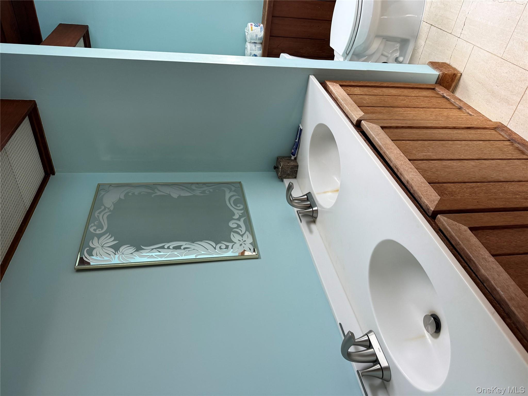 55 Lester Avenue Freeport, NY 11520 - Photo 34 of 38 a bathroom with a sink and a toilet