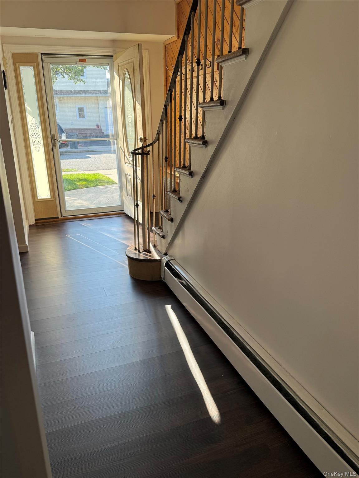 55 Lester Avenue Freeport, NY 11520 - Photo 4 of 38 a view of staircase with rug