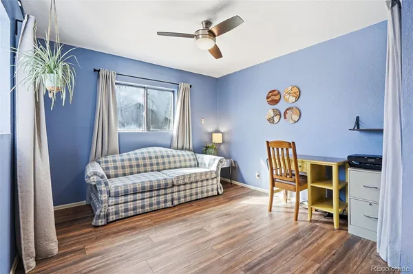 a bedroom with a bed and a table in it