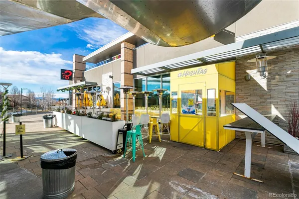 a view of a patio with table and chairs