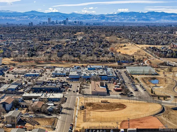 an aerial view of residential house and sandy dunes