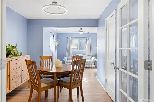 a dining room with furniture and window