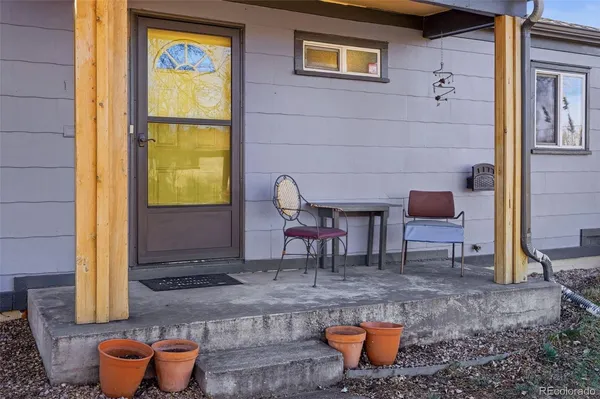 a outdoor space with patio furniture and a potted plant