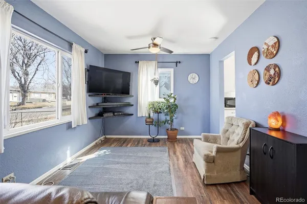 a living room with furniture and a flat screen tv